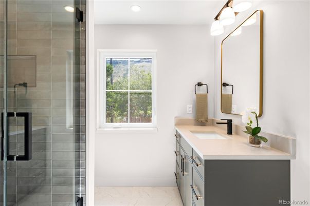 Bathroom, Dual Sink Vanities, Glass Shower, Interior, Marble, Recessed Lighting