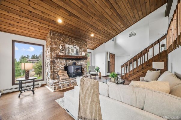 Fireplace, Interior, Living room, Recessed Lighting, Stone Walls, Wooden Ceilings, Wood Texture Flooring