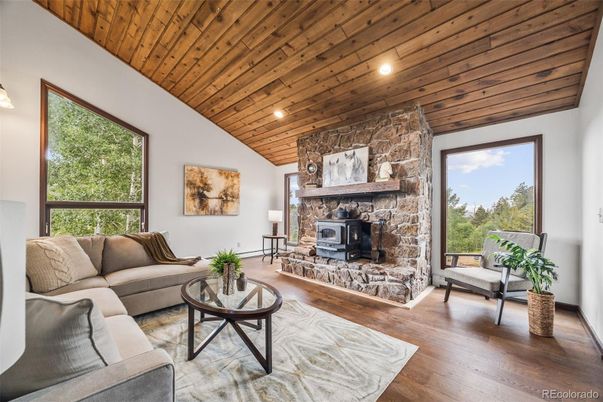 Fireplace, Interior, Living room, Recessed Lighting, Stone Walls, Wooden Ceilings, Wood Texture Flooring