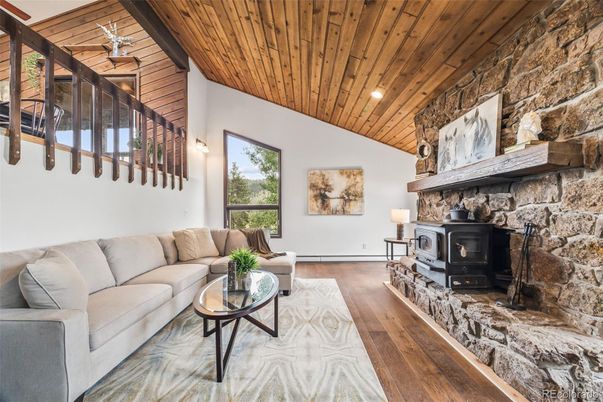 Fireplace, Interior, Living room, Recessed Lighting, Stone Walls, Wooden Ceilings, Wood Texture Flooring