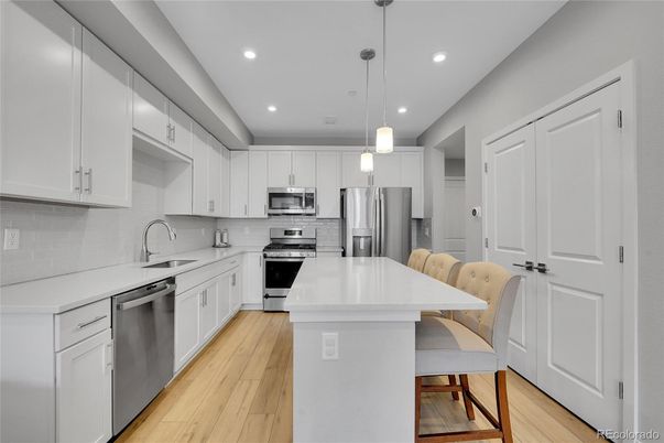 Interior, Kitchen, Pendant Lights, Recessed Lighting, Stainless Steel Appliances, Wood Texture Flooring