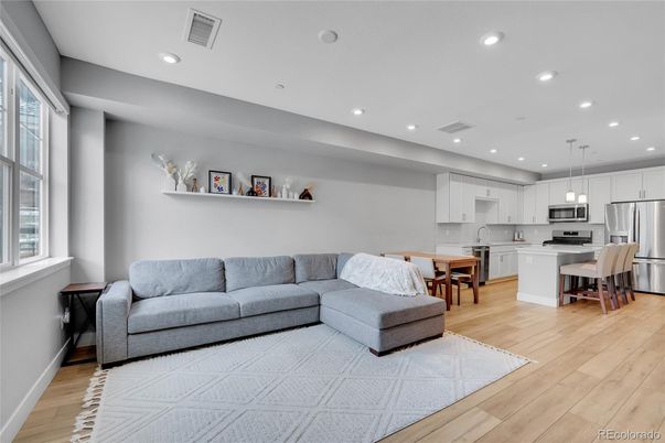 Dining room, Interior, Kitchen, Living room, Pendant Lights, Recessed Lighting, Stainless Steel Appliances, Wood Texture Flooring