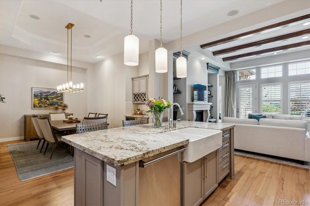 Chandelier, Dining room, Fireplace, Interior, Living room, Pendant Lights, Recessed Lighting, Wooden Beams, Wood Texture Flooring