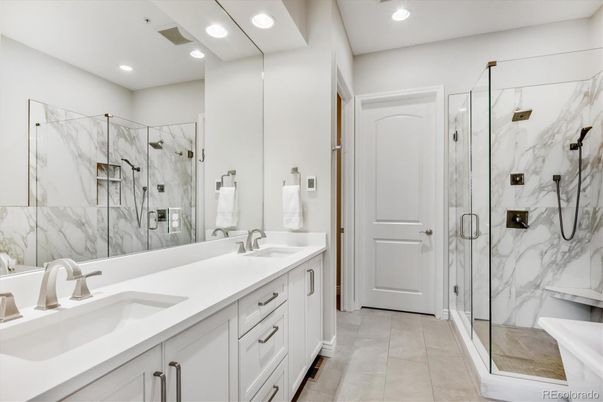Bathroom, Dual Sink Vanities, Glass Shower, Interior, Marble Walls, Recessed Lighting