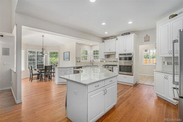 Dining room, Interior, Kitchen, Pendant Lights, Recessed Lighting, Stainless Steel Appliances, Wood Texture Flooring