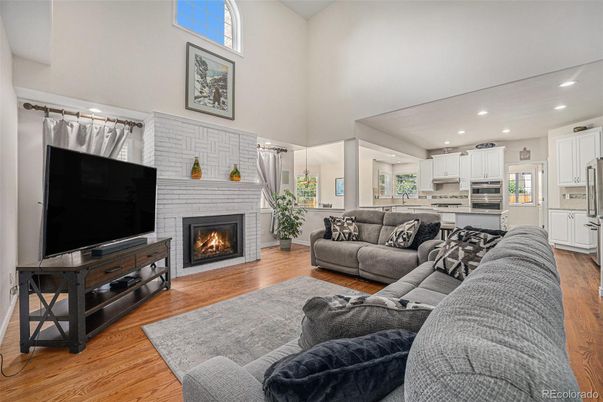 Fireplace, Interior, Kitchen, Living room, Recessed Lighting, Stainless Steel Appliances, Stone Walls, Wood Texture Flooring