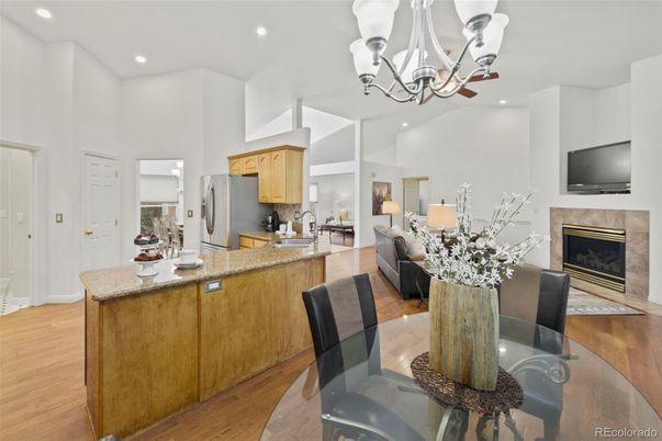 Chandelier, Dining room, Fireplace, Interior, Kitchen, Living room, Recessed Lighting, Wood Texture Flooring