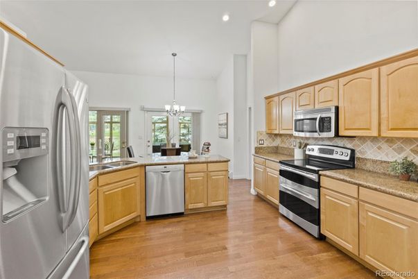 Chandelier, Interior, Kitchen, Pendant Lights, Recessed Lighting, Stainless Steel Appliances, Wood Texture Flooring