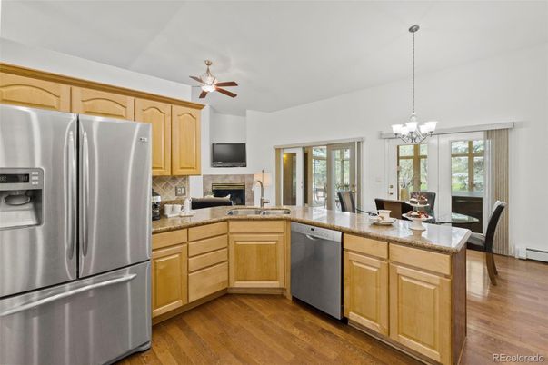 Chandelier, Dining room, Fireplace, Interior, Kitchen, Pendant Lights, Wood Texture Flooring