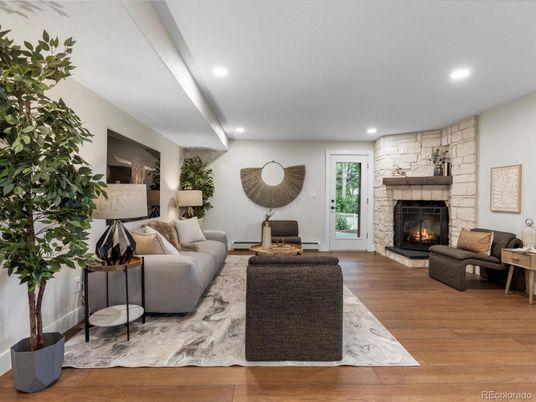 Fireplace, Interior, Living room, Recessed Lighting, Stone Walls, Wood Texture Flooring