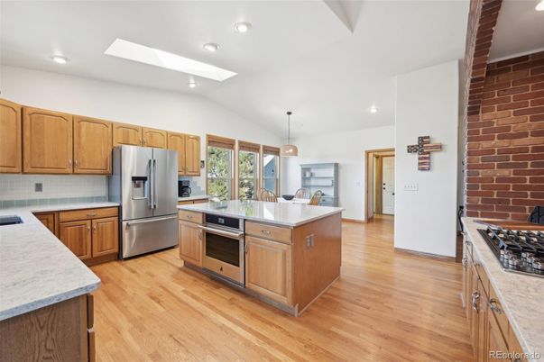 Interior, Kitchen, Pendant Lights, Recessed Lighting, Stainless Steel Appliances, Stone Walls, Wood Texture Flooring