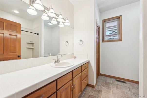 Bathroom, Dual Sink Vanities, Interior, Recessed Lighting, Tile Countertops