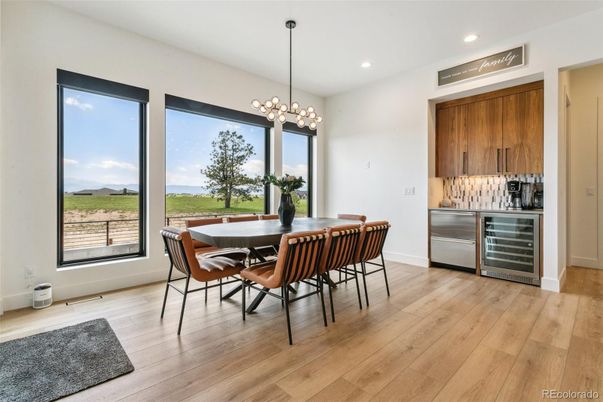 Dining room, Interior, Kitchen, Pendant Lights, Recessed Lighting, Stainless Steel Appliances, Wood Texture Flooring