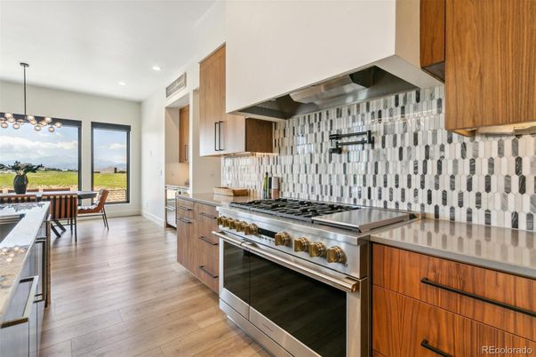 Dining room, Interior, Kitchen, Pendant Lights, Recessed Lighting, Stainless Steel Appliances, Water, Wood Texture Flooring