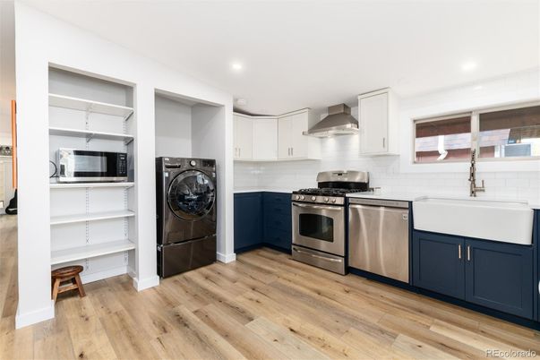 Interior, Kitchen, Recessed Lighting, Stainless Steel Appliances, Washer, Wood Texture Flooring
