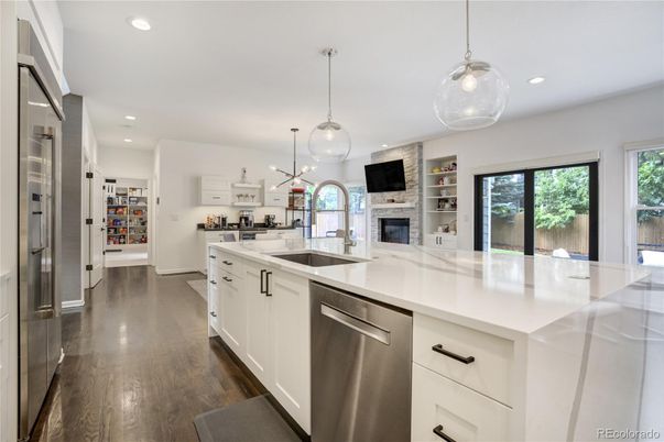 Fireplace, Interior, Kitchen, Pendant Lights, Recessed Lighting, Stainless Steel Appliances, Wood Texture Flooring
