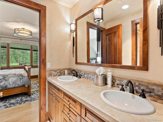 Bathroom, Dual Sink Vanities, Interior, Recessed Lighting, Tile Countertops, Wood Texture Flooring