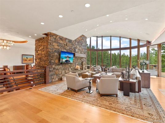 Fireplace, Interior, Living room, Recessed Lighting, Stone Walls, Wood Texture Flooring