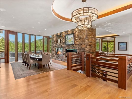 Chandelier, Dining room, Fireplace, Interior, Recessed Lighting, Stone Walls, Wood Texture Flooring