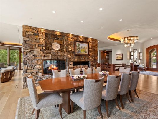 Chandelier, Dining room, Fireplace, Interior, Recessed Lighting, Stone Walls, Wood Texture Flooring