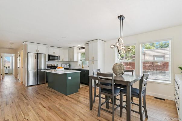 Dining room, Interior, Kitchen, Pendant Lights, Recessed Lighting, Stainless Steel Appliances, Wood Texture Flooring