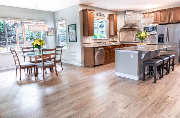 Dining room, Interior, Kitchen, Pendant Lights, Recessed Lighting, Stainless Steel Appliances, Wood Texture Flooring