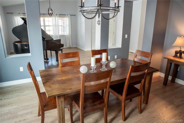 Chandelier, Dining room, Interior, Piano, Wood Texture Flooring