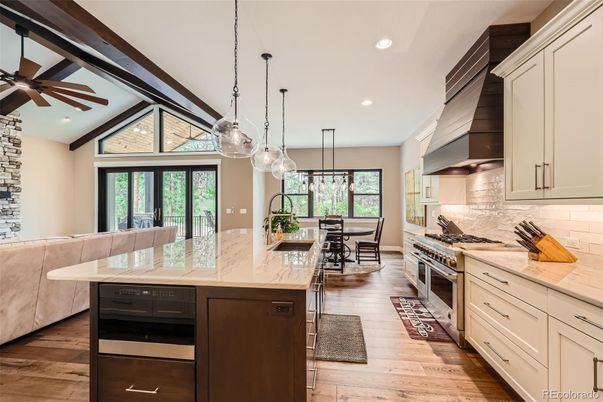 Dining room, Interior, Kitchen, Pendant Lights, Recessed Lighting, Stainless Steel Appliances, Wood Texture Flooring