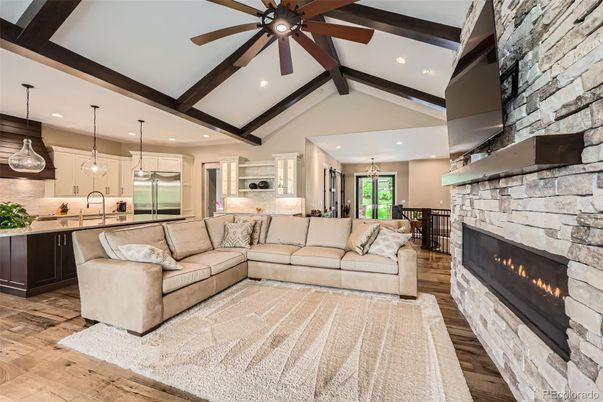 Fireplace, Interior, Kitchen, Living room, Pendant Lights, Recessed Lighting, Stainless Steel Appliances, Stone Walls, Wooden Beams, Wood Texture Flooring