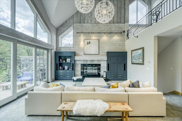 Chandelier, Fireplace, Interior, Living room, Stone Walls