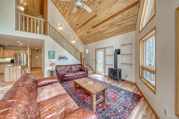 Fireplace, Interior, Kitchen, Living room, Recessed Lighting, Stainless Steel Appliances, Wooden Ceilings, Wood Texture Flooring