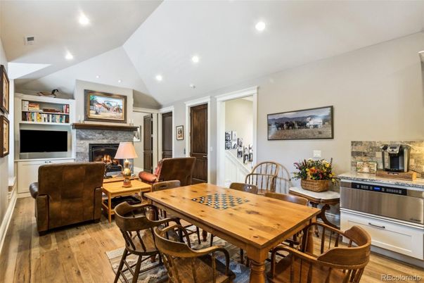 Dining room, Fireplace, Interior, Living room, Recessed Lighting, Wood Texture Flooring