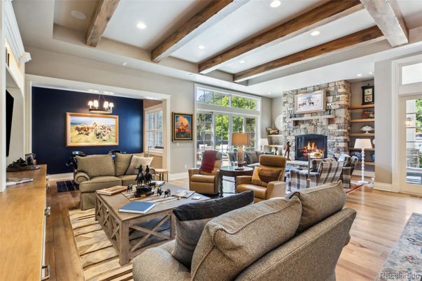 Chandelier, Fireplace, Interior, Living room, Recessed Lighting, Stone Walls, Wooden Beams, Wood Texture Flooring