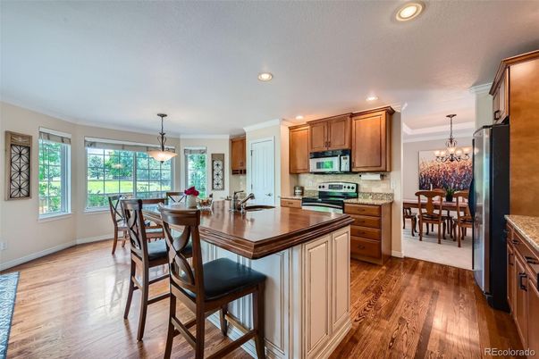 Chandelier, Dining room, Interior, Kitchen, Pendant Lights, Recessed Lighting, Stainless Steel Appliances, Wood Texture Flooring