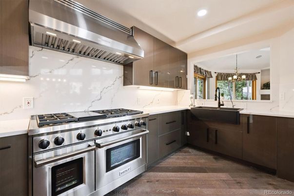 Chandelier, Interior, Kitchen, Marble Walls, Recessed Lighting, Stainless Steel Appliances, Wood Texture Flooring