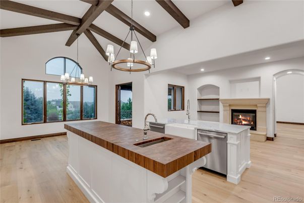 Chandelier, Fireplace, Interior, Kitchen, Pendant Lights, Recessed Lighting, Wooden Beams, Wood Texture Flooring