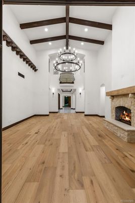 Chandelier, Fireplace, Interior, Recessed Lighting, Wooden Beams, Wood Texture Flooring