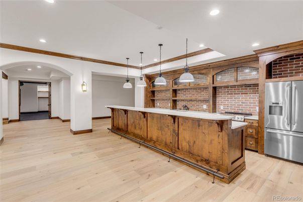 Interior, Kitchen, Pendant Lights, Recessed Lighting, Stainless Steel Appliances, Stone Walls, Wood Texture Flooring