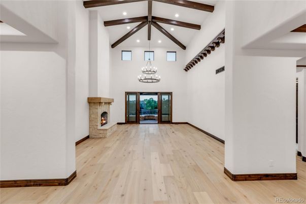 Chandelier, Fireplace, Interior, Pendant Lights, Recessed Lighting, Wooden Beams, Wood Texture Flooring