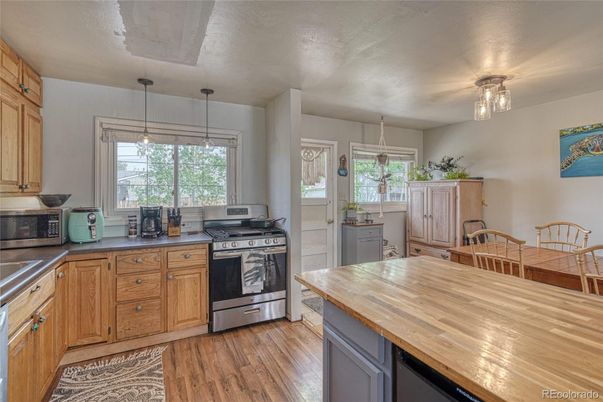 Dining room, Interior, Kitchen, Pendant Lights, Stainless Steel Appliances, Wood Texture Flooring