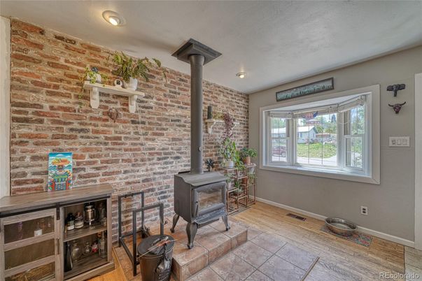 Fireplace, Interior, Recessed Lighting, Stone Walls, Wood Texture Flooring