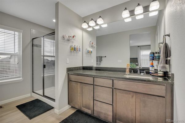 Bathroom, Dual Sink Vanities, Glass Shower, Interior, Recessed Lighting, Wood Texture Flooring