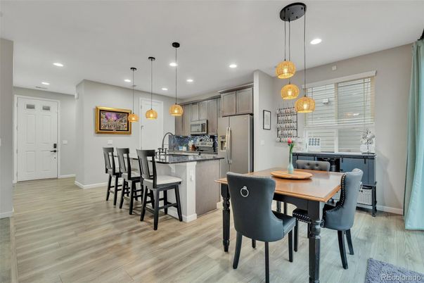 Dining room, Interior, Kitchen, Pendant Lights, Recessed Lighting, Stainless Steel Appliances, Wood Texture Flooring