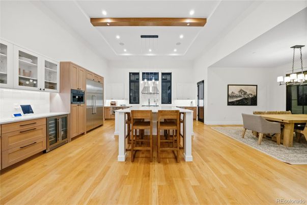Chandelier, Dining room, Interior, Kitchen, Pendant Lights, Recessed Lighting, Stainless Steel Appliances, Wood Texture Flooring