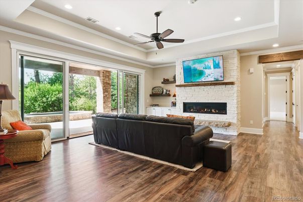 Fireplace, Interior, Living room, Recessed Lighting, Stone Walls, Wood Texture Flooring