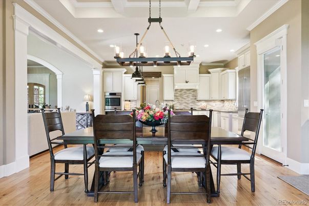 Chandelier, Dining room, Interior, Kitchen, Pendant Lights, Recessed Lighting, Stainless Steel Appliances, Wood Texture Flooring