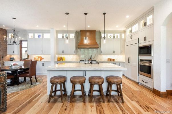 Chandelier, Dining room, Interior, Kitchen, Pendant Lights, Recessed Lighting, Stainless Steel Appliances, Wood Texture Flooring