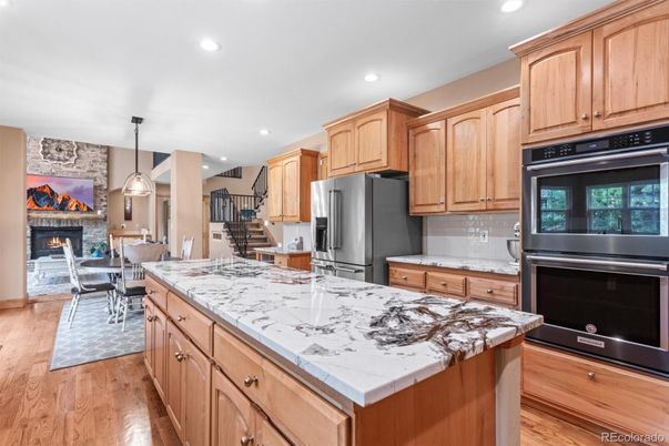 Dining room, Fireplace, Interior, Kitchen, Pendant Lights, Recessed Lighting, Stainless Steel Appliances, Wood Texture Flooring