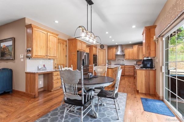 Dining room, Interior, Kitchen, Pendant Lights, Recessed Lighting, Stainless Steel Appliances, Wood Texture Flooring