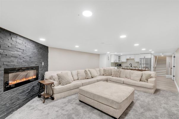 Fireplace, Interior, Kitchen, Living room, Pendant Lights, Recessed Lighting, Stone Walls, Wood Texture Flooring